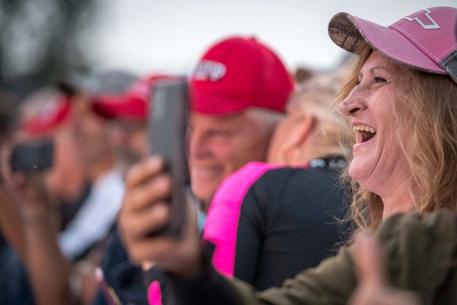 Trump supporters cheer during the Make America Great Again rally with Donald Trump Jr. and Kid Rock at Bumpers Landing Boat Club in Harrison Township, Mich on Sept. 14, 2020.