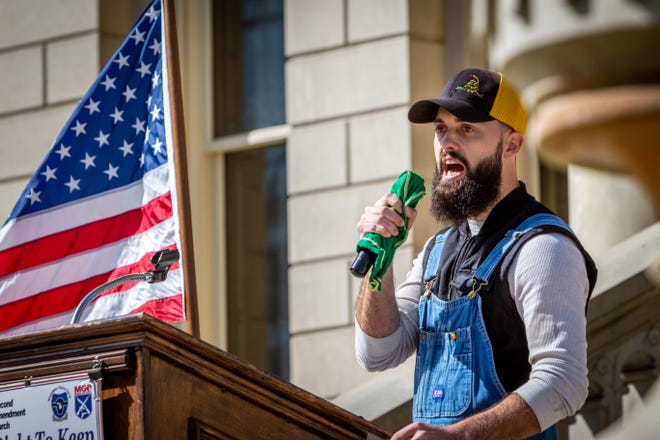 Jerry Wayne, the union worker who got into a heated gun control debate with Joe Biden at a Detroit auto plant  in March, addresses gun rights advocates at the Second Amendment March at the Capitol Building in Lansing, Michigan on September 17, 2020.