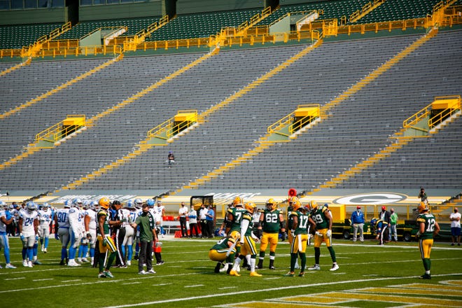 The stands at Lambeau Field are empty during the first half of an NFL football game between the Green Bay Packers and the Detroit Lions Sunday, Sept. 20, 2020, in Green Bay, Wis.