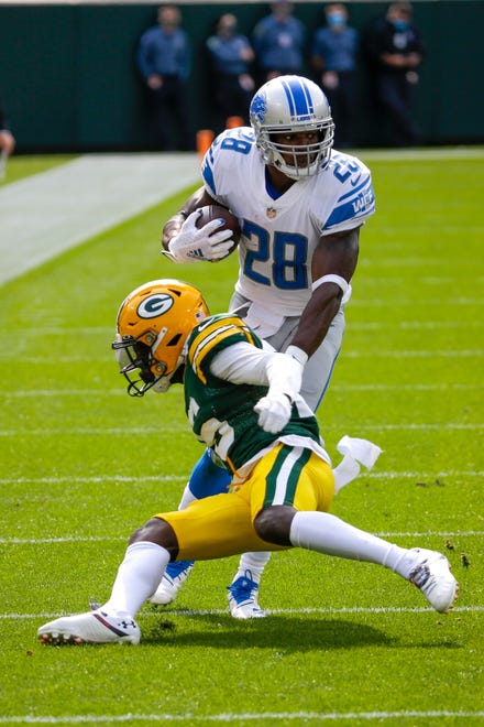 Detroit Lions' Adrian Peterson runs during the first half of an NFL football game against the Green Bay Packers Sunday, Sept. 20, 2020, in Green Bay, Wis.