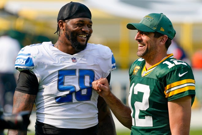 Green Bay Packers' Aaron Rodgers talks to Detroit Lions' Jamie Collins after an NFL football game Sunday, Sept. 20, 2020, in Green Bay, Wis. The Packers won 42-21.