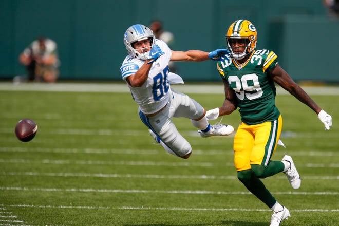 Detroit Lions' Danny Amendola can't catch a pass in front of Green Bay Packers' Chandon Sullivan during the first half of an NFL football game Sunday, Sept. 20, 2020, in Green Bay, Wis.