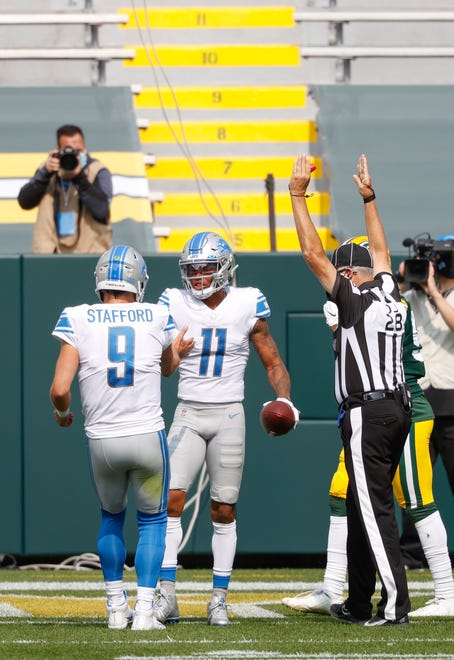 Detroit Lions' Matthew Stafford(11) reacts with Marvin Jones Jr.(11) after a touchdown against the Green Bay Packers during an NFL football game, Sunday, Sept. 20, 2020, in Green Bay, Wis.