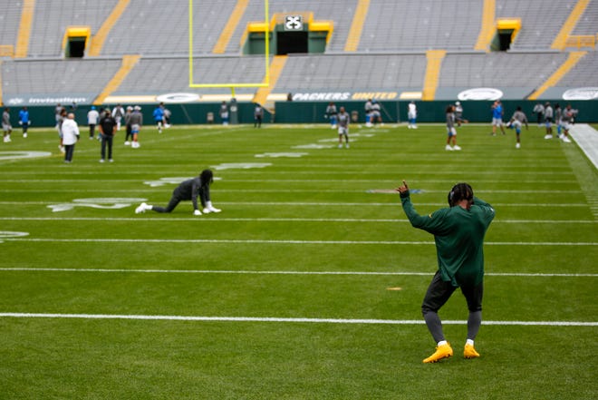 Green Bay Packers' Jamaal Williams dances to some music before an NFL football game against the Detroit Lions.