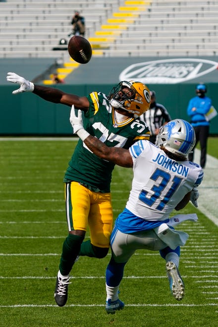 Green Bay Packers' Josh Jackson breaks up a pass intended for Detroit Lions' Ty Johnson during the second half of an NFL football game Sunday, Sept. 20, 2020, in Green Bay, Wis.