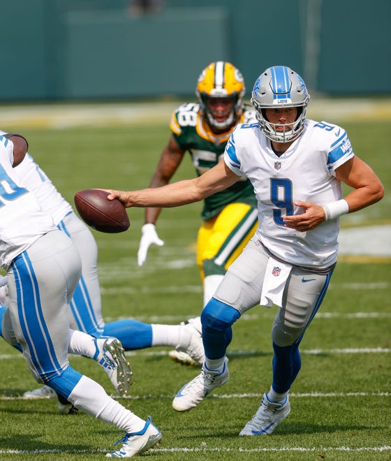 Detroit Lions' Matthew Stafford rolls out of the pocket against the Green Bay Packers during an NFL football game, Sunday, Sept. 20, 2020, in Green Bay, Wis.