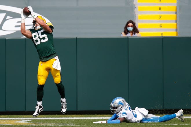 Green Bay Packers' Robert Tonyan catches a touchdown pass during the first half of an NFL football game against the Detroit Lions Sunday, Sept. 20, 2020, in Green Bay, Wis.