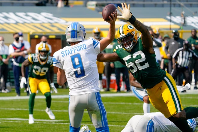 Detroit Lions' Matthew Stafford throws an interception to Green Bay Packers' Chandon Sullivan (39) during the second half of an NFL football game Sunday, Sept. 20, 2020, in Green Bay, Wis.