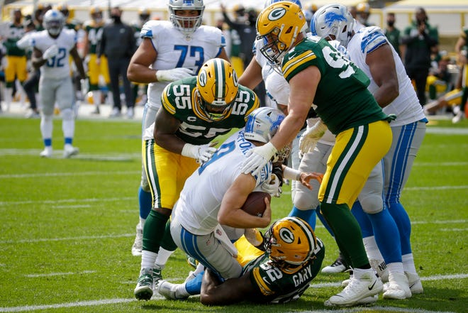 Detroit Lions quarterback Matthew Stafford is sacked during the first half of an NFL football game against the Green Bay Packers Sunday, Sept. 20, 2020, in Green Bay, Wis.