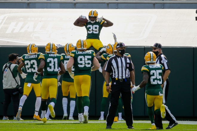 Green Bay Packers' Chandon Sullivan celebrates his interception and touchdown return during the second half of an NFL football game against the Detroit Lions Sunday, Sept. 20, 2020, in Green Bay, Wis.