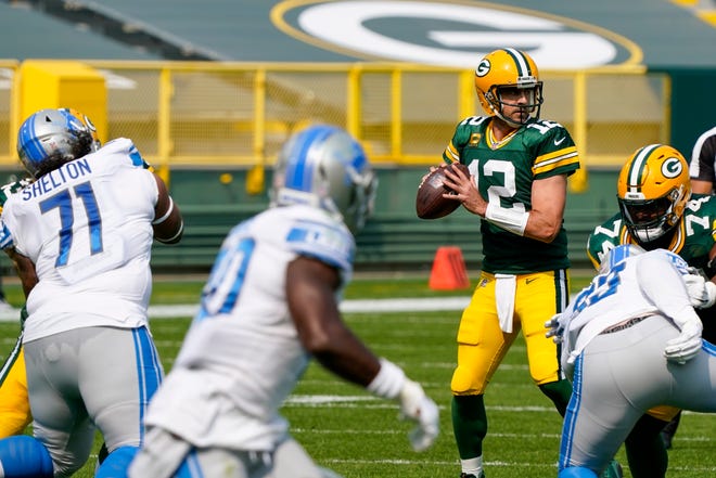 Green Bay Packers' Aaron Rodgers throws during the first half of an NFL football game against the Detroit Lions Sunday, Sept. 20, 2020, in Green Bay, Wis.