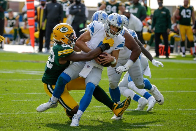 Green Bay Packers' Rashan Gary sacks Detroit Lions quarterback Matthew Stafford during the second half of an NFL football game Sunday, Sept. 20, 2020, in Green Bay, Wis.