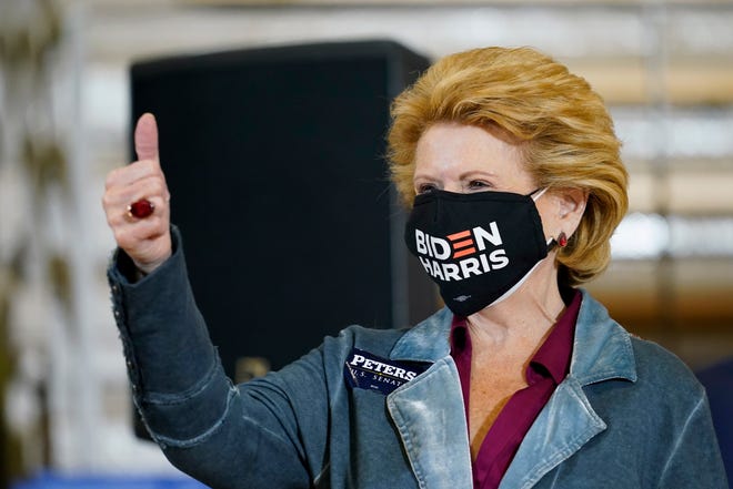 Sen. Debbie Stabenow, D-Mich., gives a thumbs up as she arrives for an event with Democratic presidential candidate former Vice President Joe Biden at Beech Woods Recreation Center, in Southfield, Mich., Friday, Oct. 16, 2020.