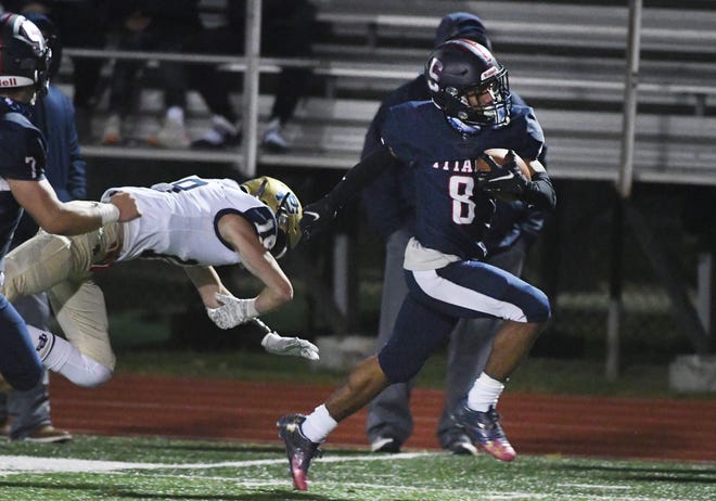 Stevenson's Tony Shumate breaks through Grosse Pointe South's defense and takes it all the way into the end zone to break 35-35 tie late in the second half.  Sterling Heights Stevenson went on to win, 42-35, in Sterling Heights, Michigan on October 16, 2020.