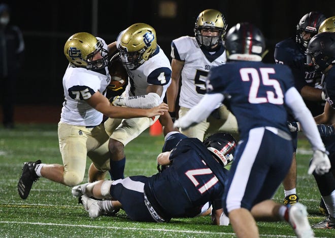 On fourth down, Grosse Pointe South's Joe Labadie and Will Johnson collide, preventing the first down and turning the ball over to Sterling Heights Stevenson, which ran out the clock out and preserved the 42-35 victory.