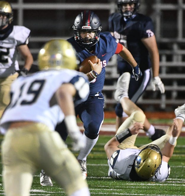Stevenson quarterback Biaglo Madonna heads upfield for a long first down in the first half.