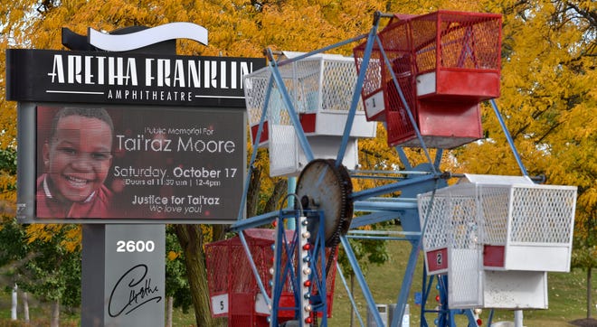 The Aretha Franklin Amphitheatre announces the public memorial of Tai'raz Moore, near this small ferris wheel ride.