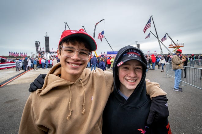 Friends Anthony Netti (left, 16) of Grand Rapids and Ethan Phillips (16) of Middleville attend their first Trump rally. Netti stated "I'm so excited to see President Trump. I've been waiting for this for forever and I'm finally getting to see him in person." President Donald Trump spoke to supporters at a rally at Muskegon County Airport in Muskegon on Oct. 17, 2020.