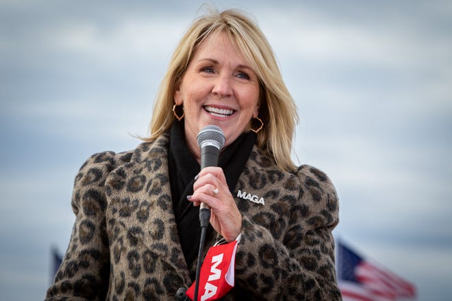 Michigan GOP chairwoman, Laura Cox, addresses the crowd before President Donald Trump speaks to supporters at a rally at Muskegon County Airport in Muskegon on Oct. 17, 2020.