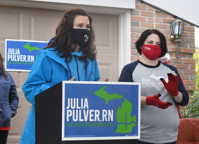 Michigan Governor Gretchen Whitmer and Julia Pulver, Candidate for 39th House District answering questions during a press conference, before heading out to campaign, in West Bloomfield Township, Michigan on October 18, 2020.