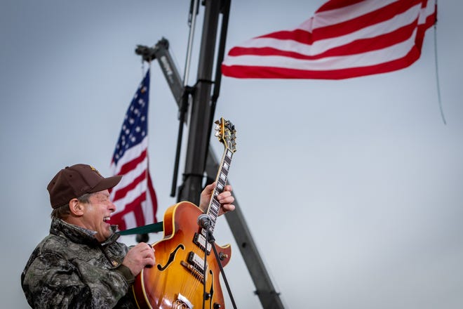 Ted Nugent plays the American national anthem at a rally for President Donald Trump at Muskegon County Airport in Muskegon on Oct. 17, 2020.