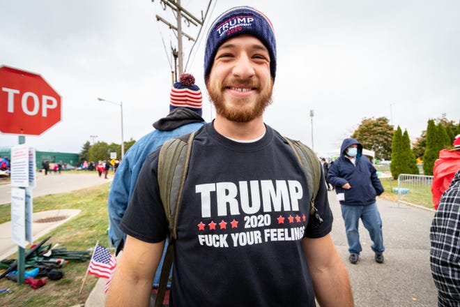 David Smith of Ludington waits in line to enter the rally. President Donald Trump spoke to supporters at a rally at Muskegon County Airport in Muskegon on Oct. 17, 2020.
