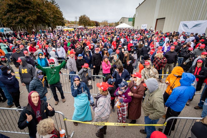 A queue forms outside the rally for U.S. President Donald Trump at Muskegon County Airport in Muskegon on Oct.17, 2020.