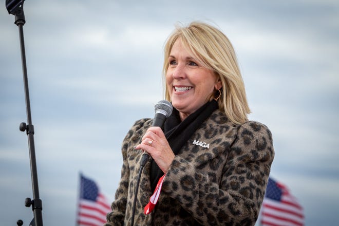 Michigan GOP chairwoman, Laura Cox, addresses the crowd before President Donald Trump speaks to supporters at a rally at Muskegon County Airport in Muskegon on Oct. 17, 2020.
