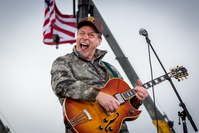 Ted Nugent plays the American national anthem at a rally for President Donald Trump at Muskegon County Airport in Muskegon on Oct. 17, 2020.