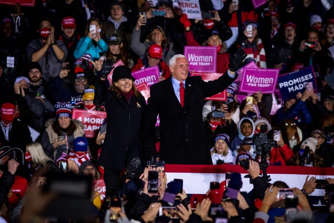 Vice President and Second Lady Mike and Karen Pence enter the rally before President Donald Trump delivers remarks at his fifth and final rally of the day—and the campaign—at Gerald R. Ford Airport in Grand Rapids, Michigan on November 2, 2020.  The rally started at midnight and went into election day.