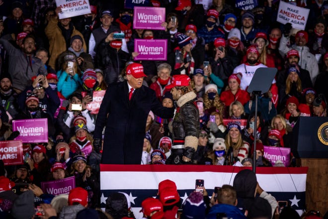 Rapper Lil Pump is invited on stage by President Donald Trump while delivering remarks at his fifth and final rally of the day—and the campaign—at Gerald R. Ford Airport in Grand Rapids, Michigan on November 2, 2020.  The rally started at midnight and went into election day.