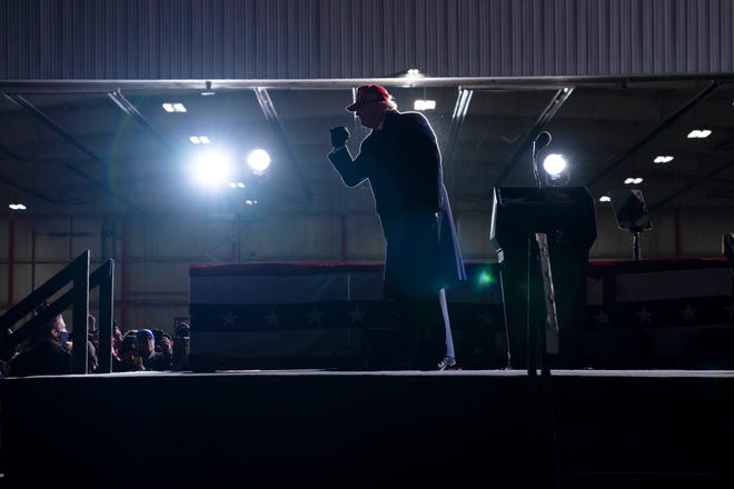 President Donald Trump walks off stage after speaking during a campaign rally at Cherry Capital Airport, Monday, Nov. 2, 2020, in Traverse City, Mich.