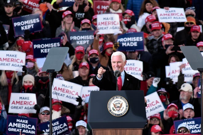 Vice President Mike Pence speaks before President Donald Trump at a campaign rally in Traverse City, Mich. Monday, Nov. 2, 2020.
