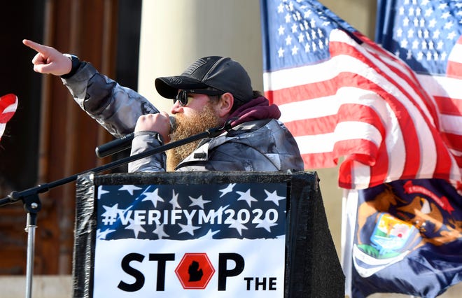 Kevin Skinner speaks to the crowd as  President Donald Trump supporters gather at the state Capitol Building  in Lansing for a "Stop the Steal" rally disputing the presidential voting Saturday, October 14, 2020.