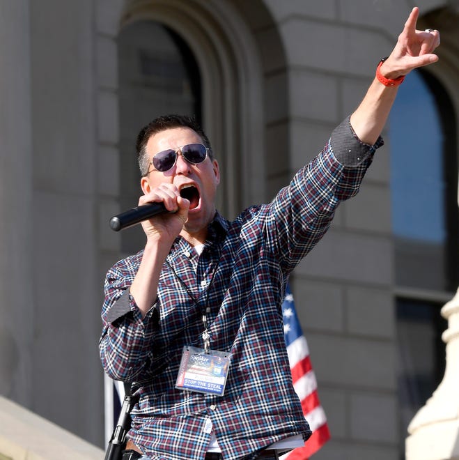 Ryan Kelley of the American Patriot Council fires up the crowd as he speaks as President Donald Trump supporters gather at the state Capitol Building  in Lansing for a "Stop the Steal" rally disputing the presidential voting Saturday, October 14, 2020.