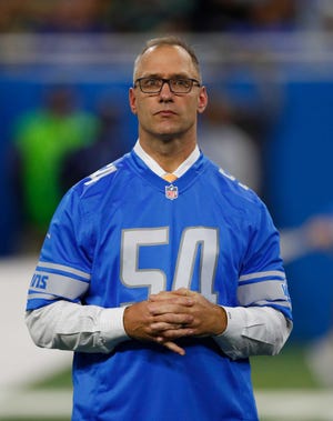 Chris Spielman wears his former No 54 jersey while being honored at a Lions game.
