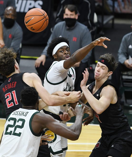 Michigan State's Gabe Brown fights for a rebound in the first half.