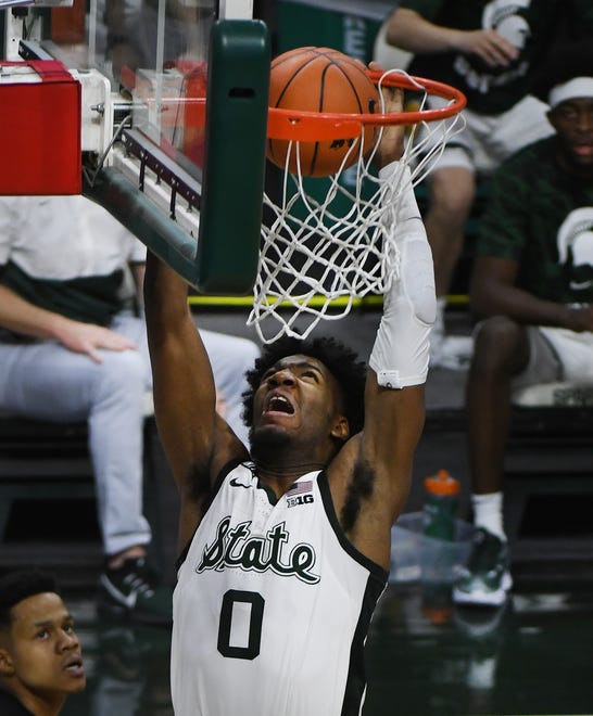 Oh Henry!  Michigan State's Aaron Henry slams two points down in the early part of the second half of the 68-45 victory over Rutgers at the Breslin Center in East Lansing, Michigan  on Jan. 5, 2021.