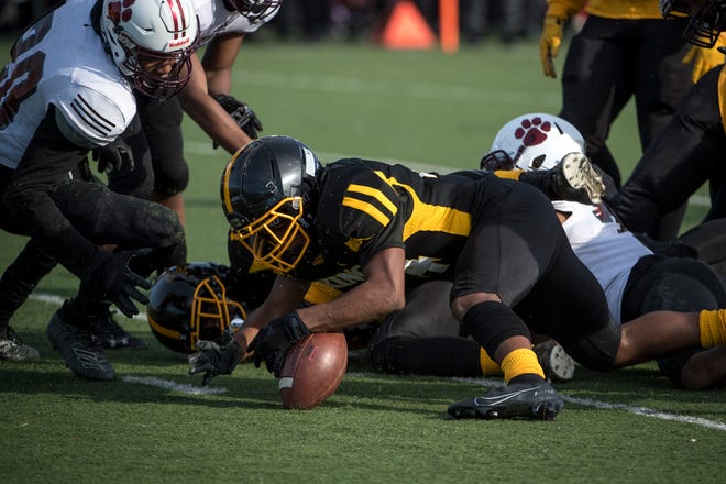 Detroit King junior defensive back Tre’vion Meadows (24) recovers a fumble during the first half.
