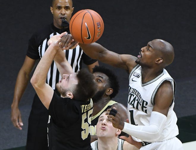 Purdue's Sasha Stefanovic gets the ball swiped away by Michigan State's Joshua Langford in the second half.