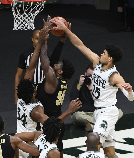 Purdue's Trevion Williams shot is blocked and knocked out of bounds by Michigan State's Malik Hall in the second half.