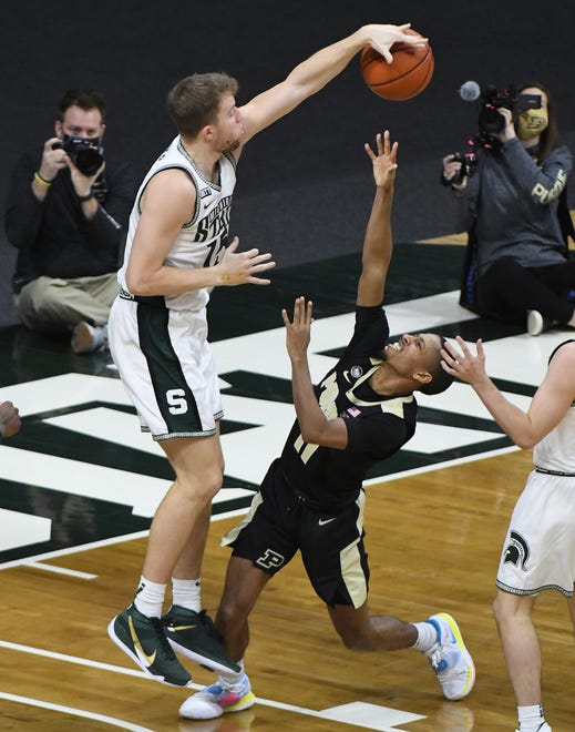 Michigan State's Thomas Kithier blocks a shot by Purdue's Isaiah Thompson in the second half.