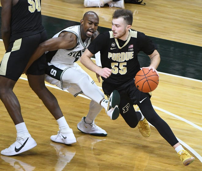 Michigan State's Joshua Langford chases after Purdue's Sasha Stefanovic in the second half.