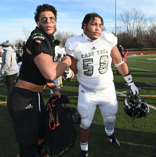 Belleville's Jamari Buddin (17) shakes hands with Cass Tech's Jarvis Windom (58) after the game.