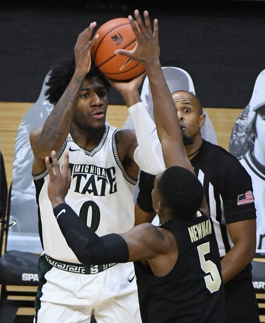 Michigan State's Aaron Henry puts up a 3-point attempt over Purdue's Brandon Newman in the second half.