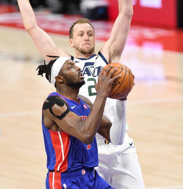 Pistons' Jerami Grant is fouled by Jazz's Joe Ingles in the second quarter. Grant finished with 28 points to lead the Pistons.