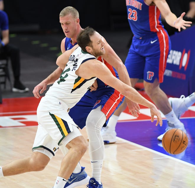 Pistons' Mason Plumlee fouls Jazz's Bojan Bogdanović in the first quarter.