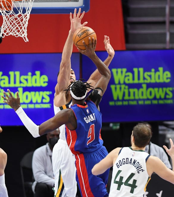 Jazz's Rudy Gobert blocks the shot of Pistons' Jerami Grant in the third quarter.