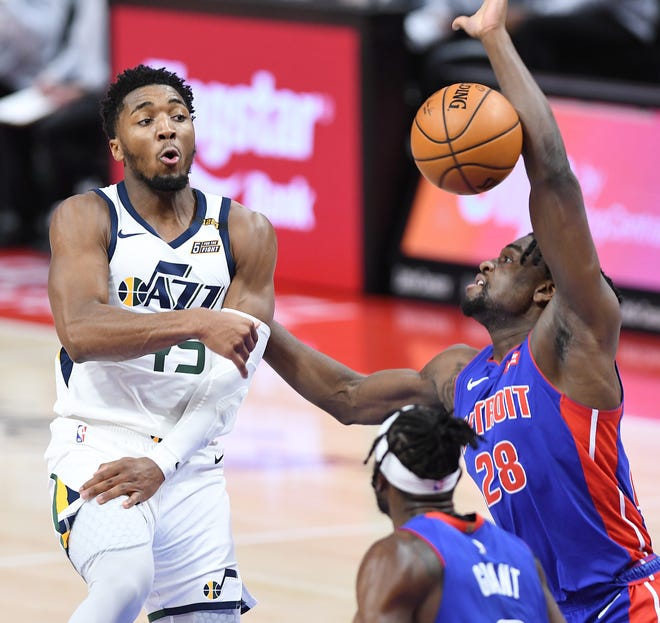 A pass by Utah Jazz's Donovan Mitchell is blocked by Detroit Pistons' Isaiah Stewart in the third quarter on Sunday, Jan. 10, 2021 at Little Caesars Arena in Detroit.
 The Jazz defeated the Pistons, 96-86.