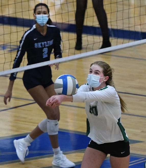 Novi's Rachel Karr gets under the ball setting it up for a teammate.